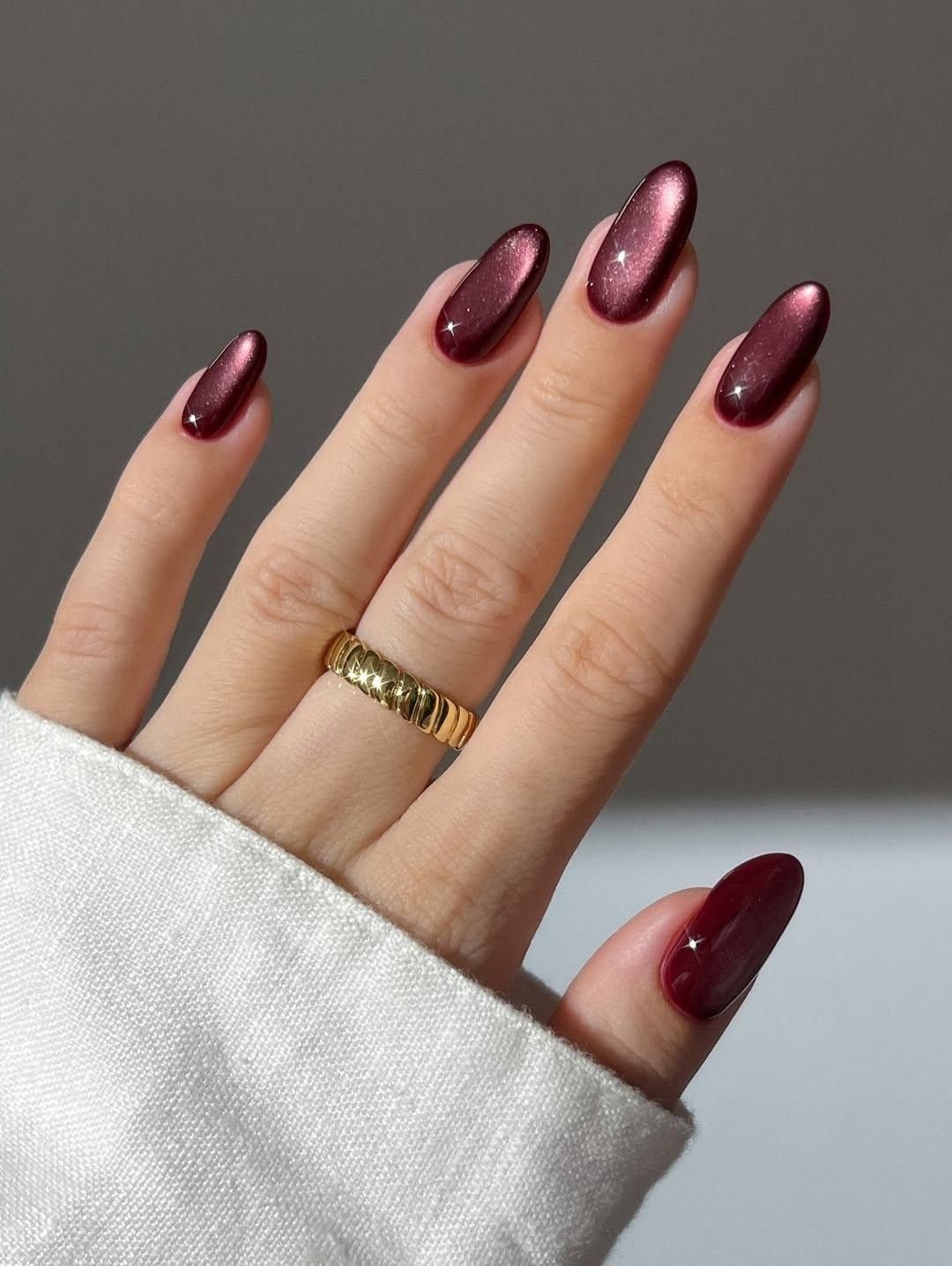 Cat-eye magnetic finish on a Gel X almond set.