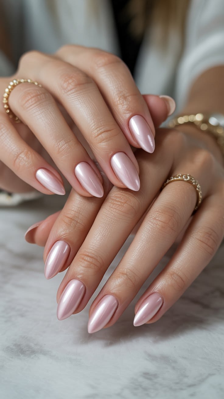 Chrome finish on a short almond nail shape.