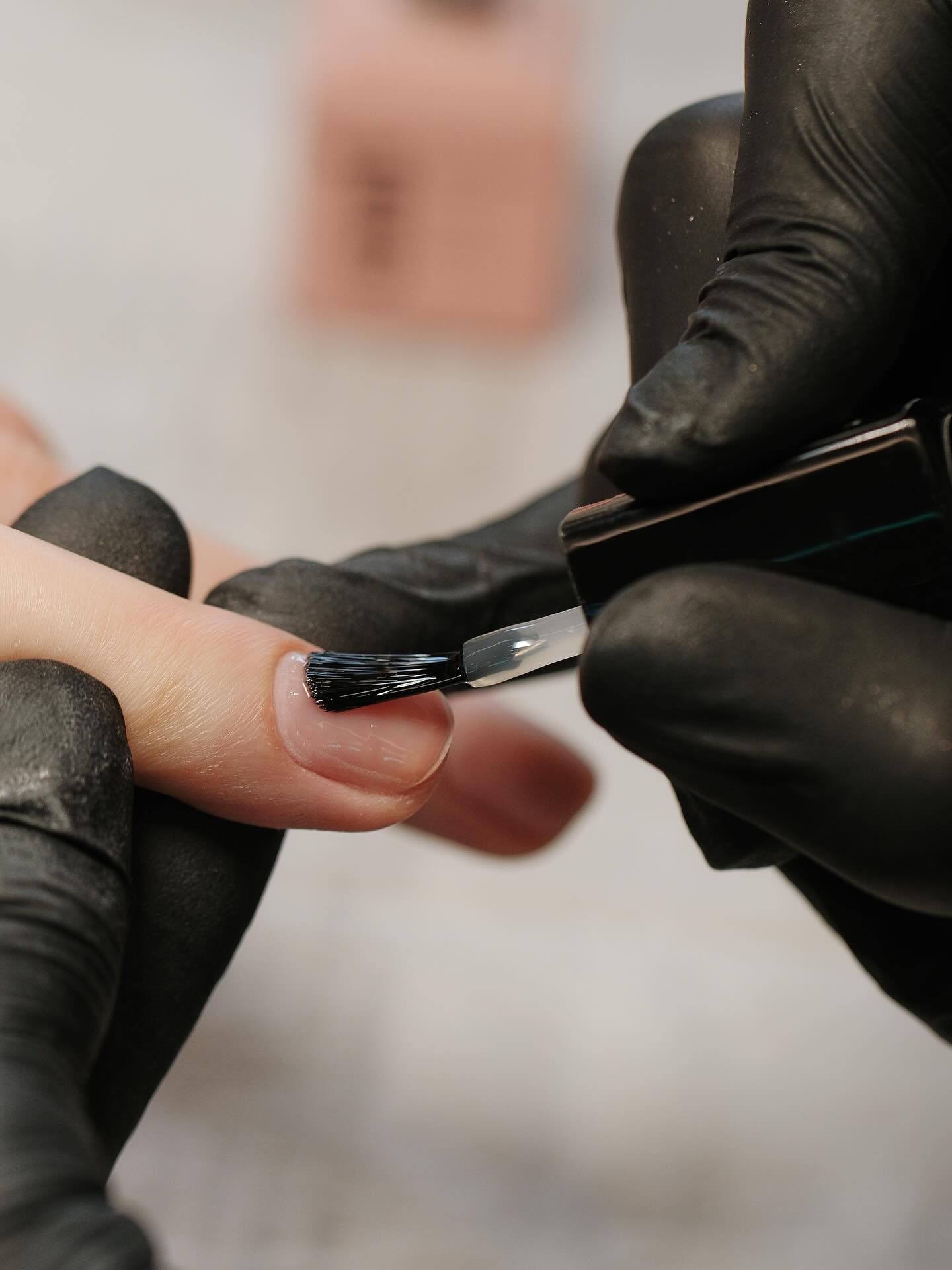 A clean builder gel base layer on a natural almond nail.