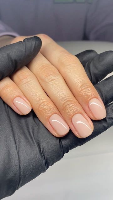 A finished hard gel overlay on short round nails in a sheer nude, fresh at the chair.